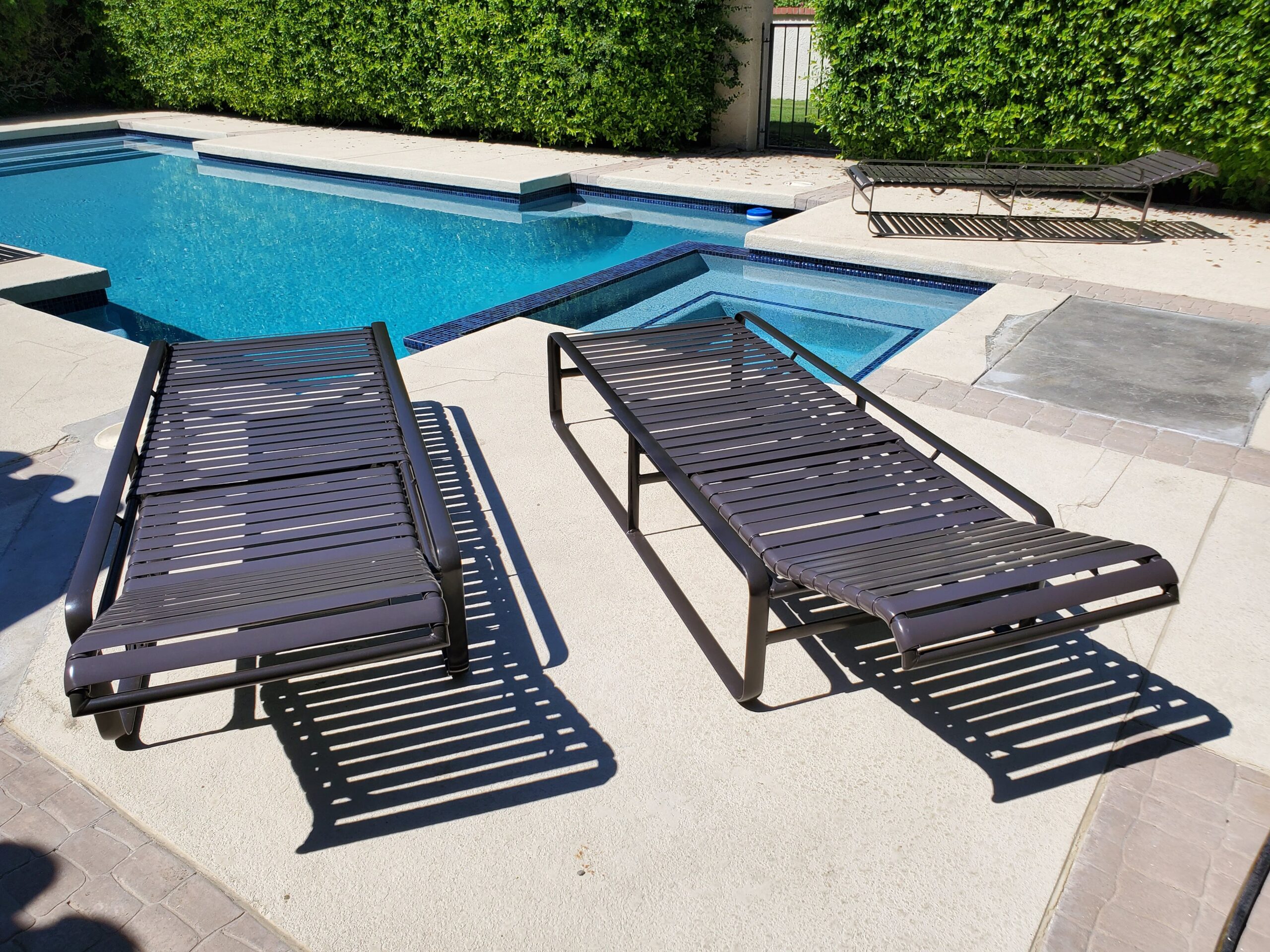 Chaise lounge with fresh brown vinyl straps after re-strapping