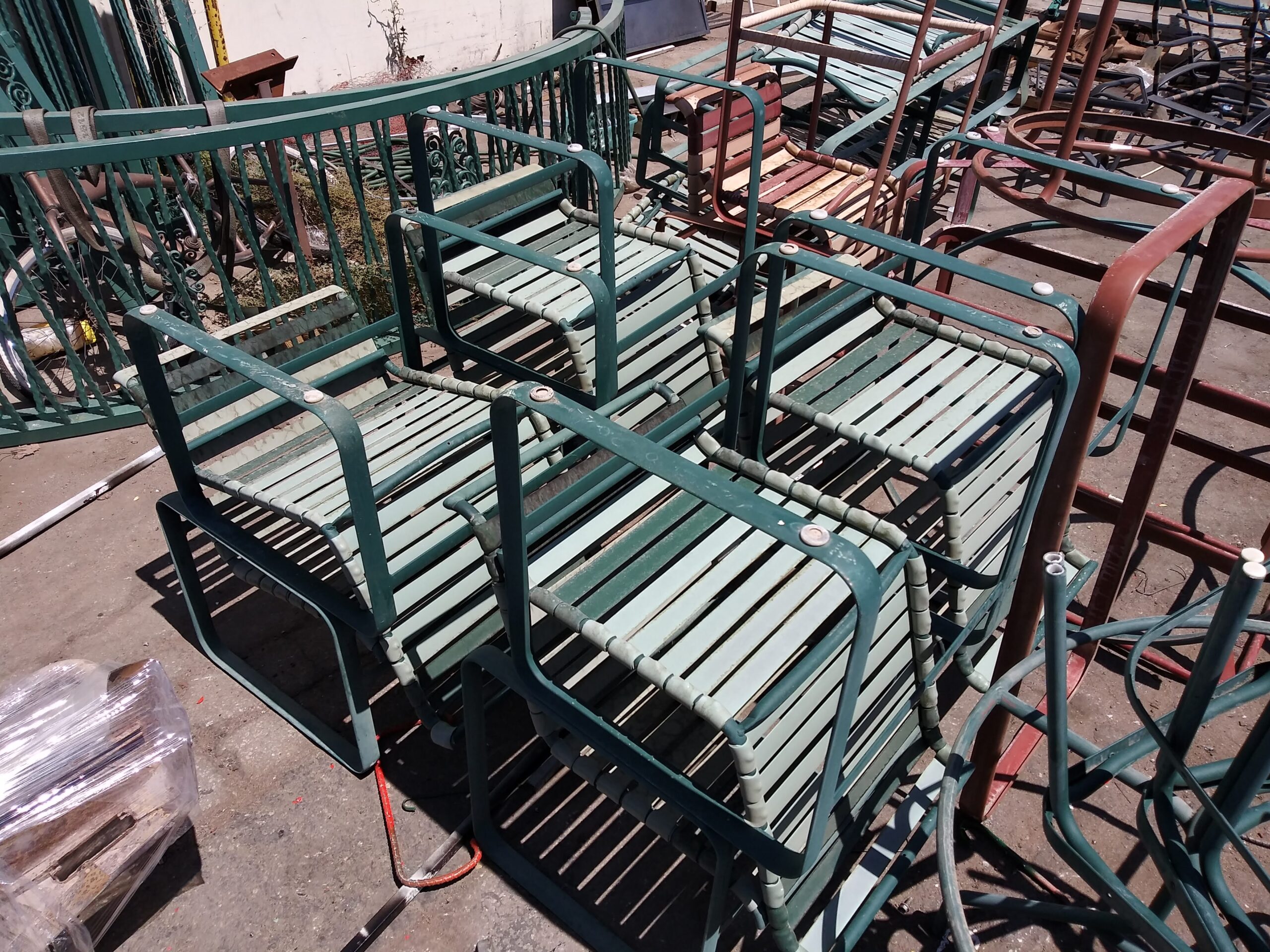 Chaise lounge with worn vinyl straps before re-strapping